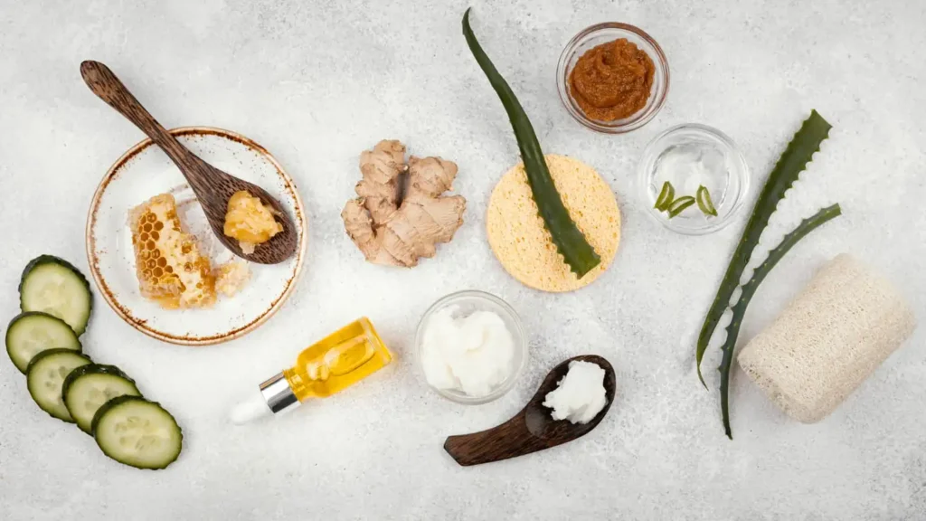 Natural skincare ingredients including aloe vera, honey, oats, green tea, avocado, and vitamin-rich fruits arranged for skin health.