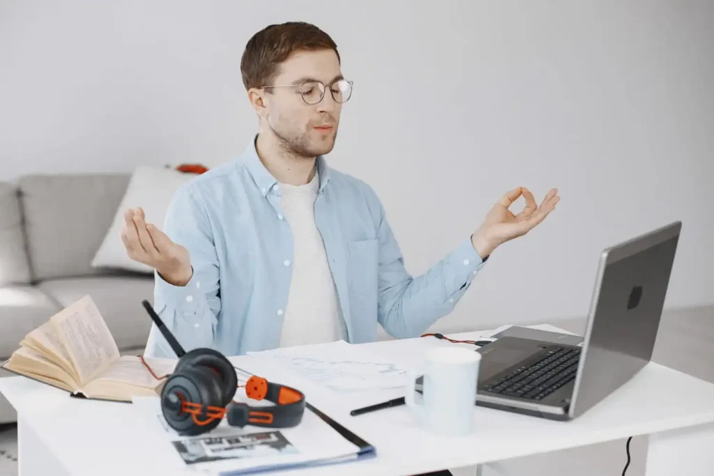Person practicing stress management techniques through meditation, exercise, healthy habits, and relaxation in a calm environment.
