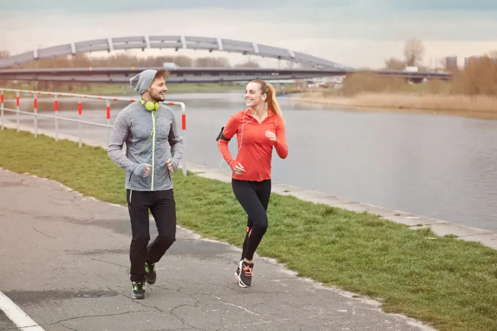 A person jogging outdoors in the early morning, illustrating the health and fitness benefits of morning running, including improved cardiovascular health, energy, and mood.